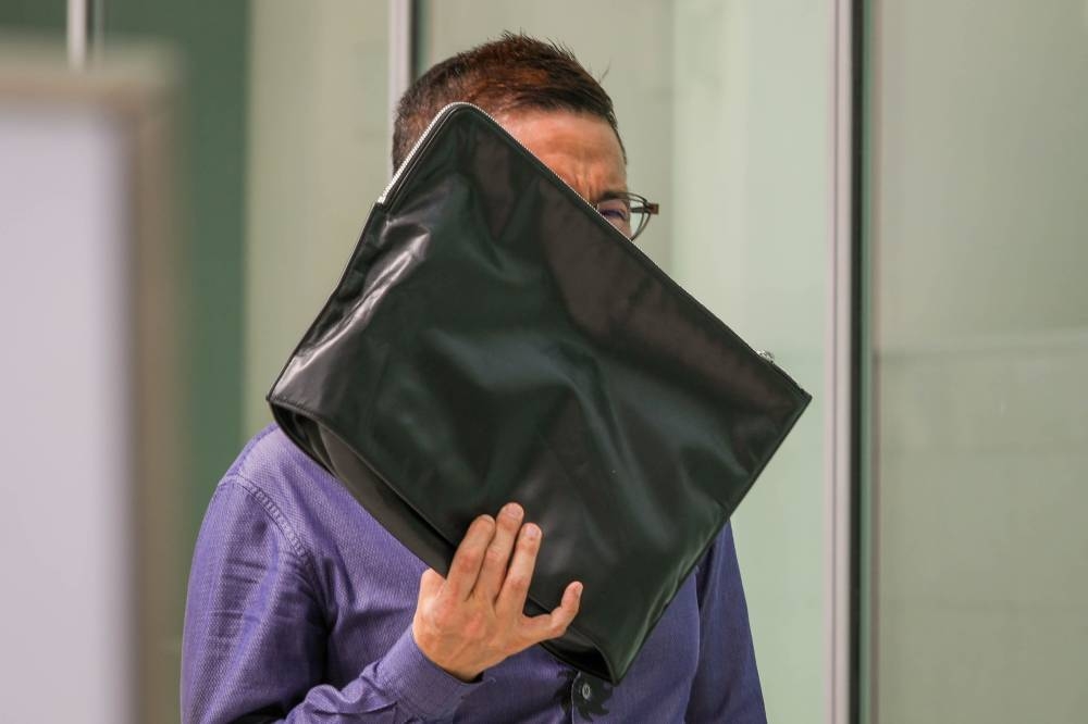 Leo Norman Chee Wei Kiong leaving the State Courts on June 9, 2021. ― TODAY pic