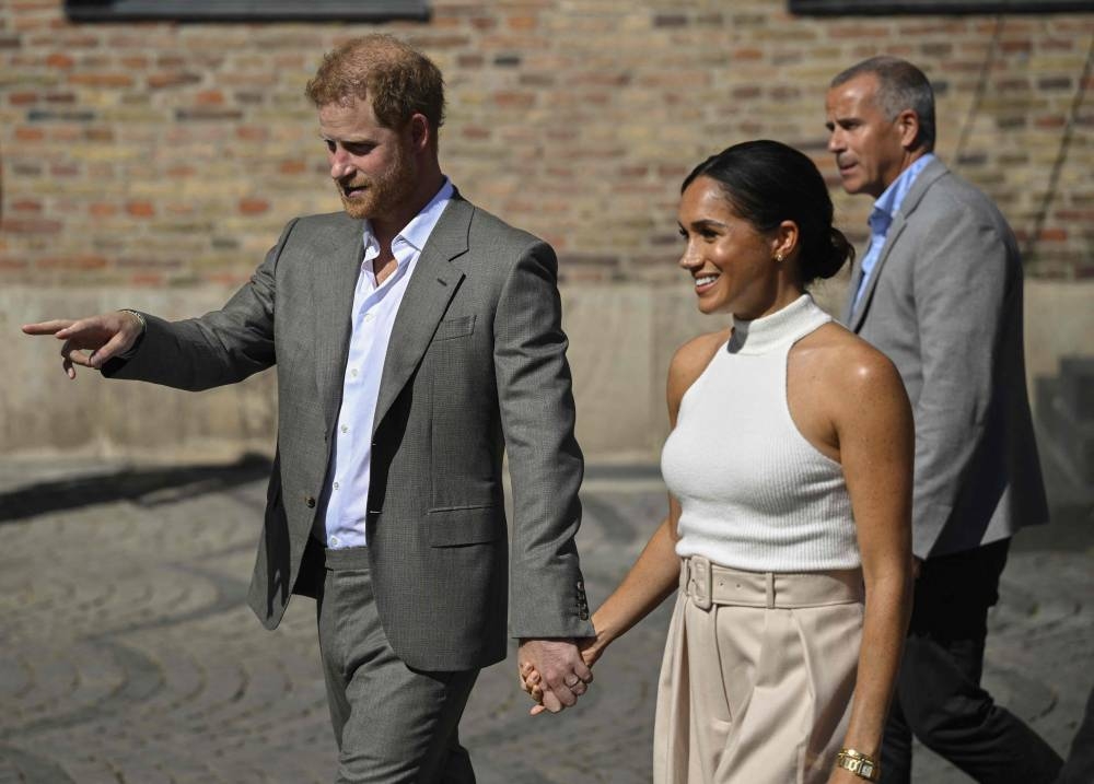 Meghan, Duchess of Sussex, and Prince Harry, Duke of Sussex leave the the city hall in Duesseldorf, western Germany, on September 6, 2022 after attending a reception in the context of the 