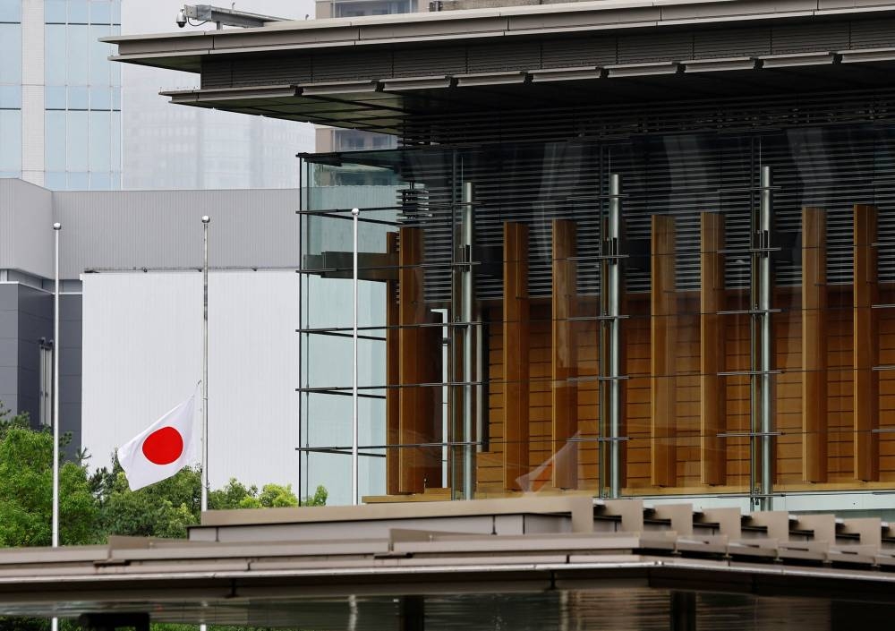 Japan’s national flag flies at half staff to mourn the death of Queen Elizabeth at Japanese prime minister's official residence in Tokyo, Japan September 9, 2022. — Reuters pic