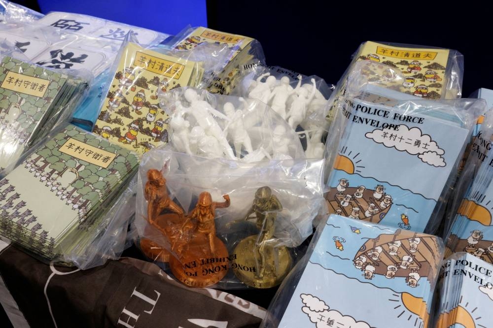 Children’s books are pictured during a news conference after five people were arrested on suspicion of conspiring to publish ‘seditious material’ with the intent of inciting public hatred towards the government among children, in Hong Kong, China, July 22, 2021. ― Reuters pic