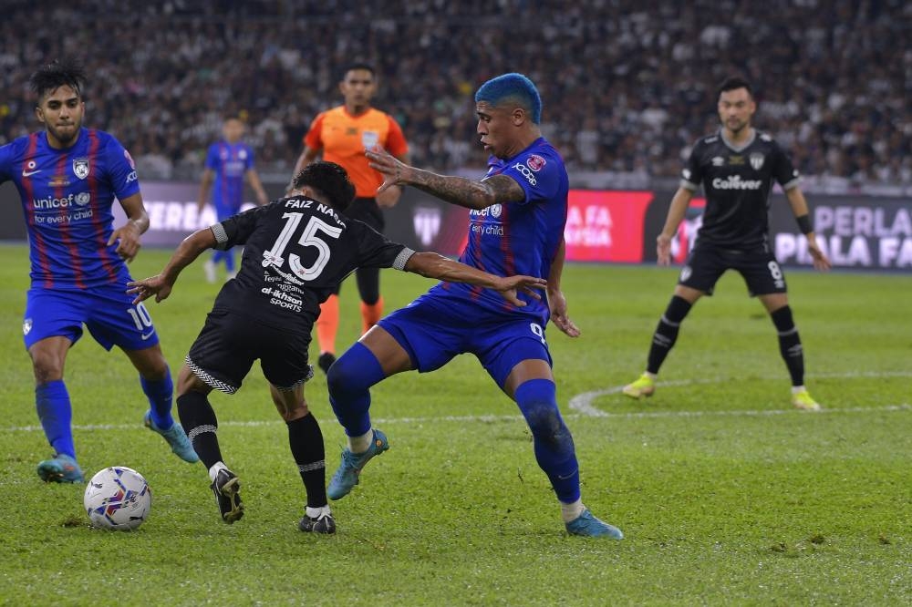 JDT player Bergson da Silva (second right) in action when pushed by Terengganu FC player Faiz Nasir in the FA Cup Final match, JDT against Terengganu FC at Bukit Jalil National Stadium September 10, 2022. — Bernama pic