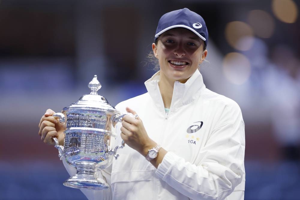 Iga Swiatek of Poland celebrates with the championship trophy after defeating Ons Jabeur of Tunisia at the 2022 US Open in New York City September 11, 2022..— Sarah Stier/Getty Images/AFP pic