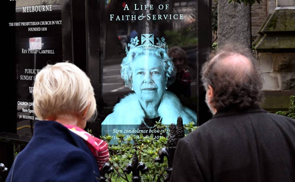 A portrait of the Queen is displayed outside a church in Melbourne on September 10, 2022, following the passing of Britain's Queen Elizabeth II. — AFP pic