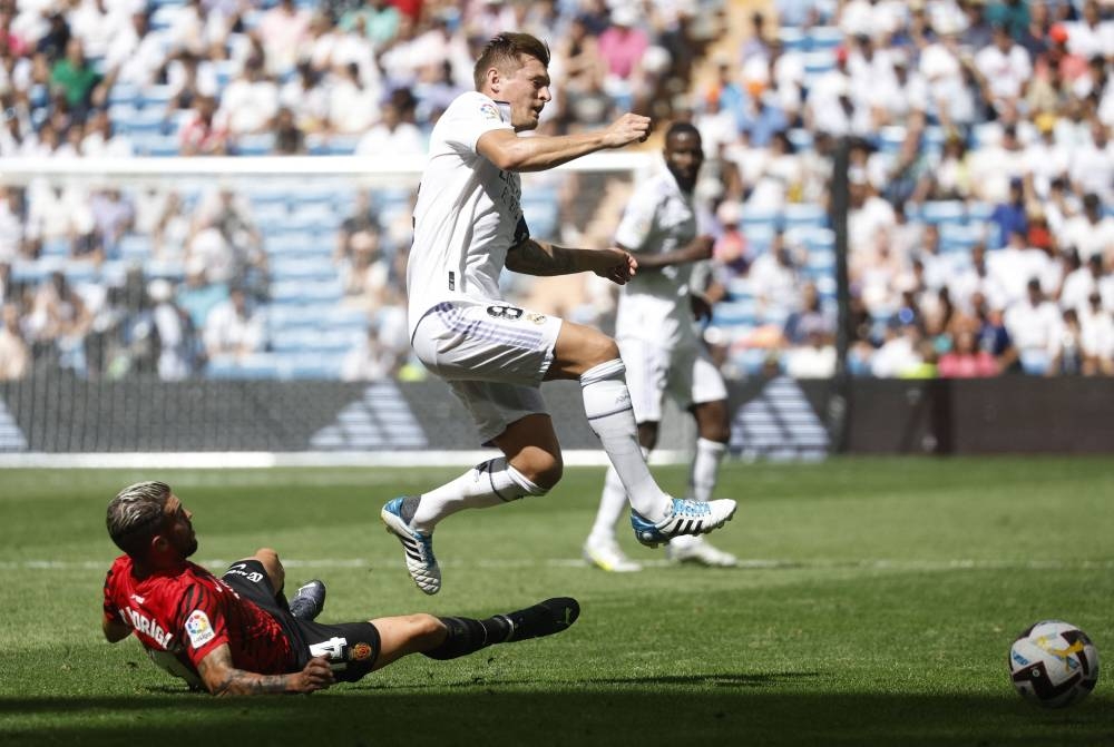 Real Madrid's Toni Kroos in action with RCD Mallorca's Dani Rodriguez at the Santiago Bernabeu, Madrid, Spain September 11, 2022. — Reuters pic