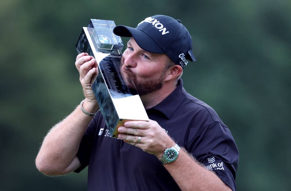 Ireland's Shane Lowry celebrates kissing the trophy after winning the BMW PGA Championship at the Wentworth Golf Club, Virginia Water, Britain September 11, 2022. — Reuters pic