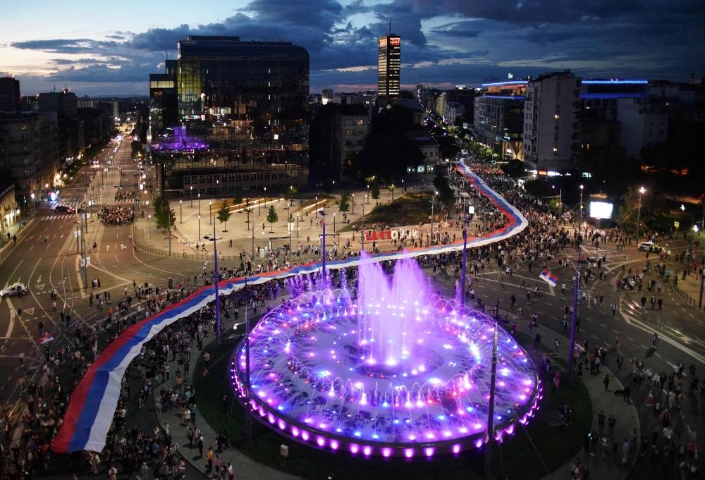 Orthodox Christian believers carry a 500m long Russian and Serbian national flags banner as they attend a joint prayer for salvation of Serbia', a rally 