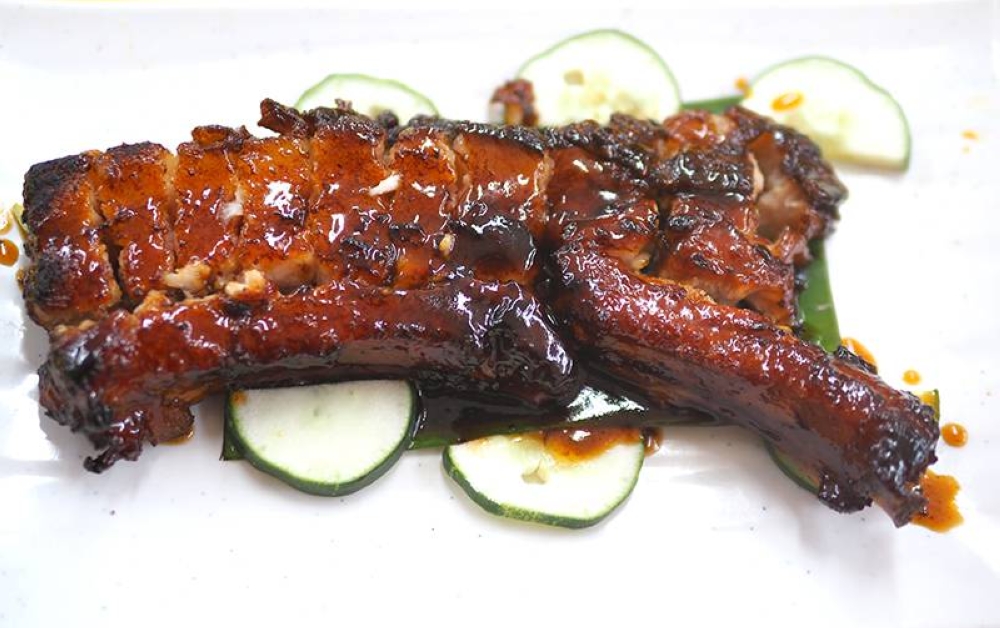 Hao Yue Lou Restaurant's signature BBQ pork rib is definitely a must eat with its wobbly fat and tender meat coated in a not-too-sweet sauce. – Pictures by Lee Khang Yi