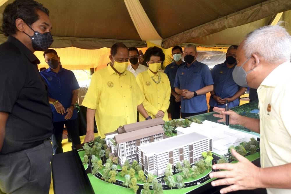 Sultan of Kedah Al Aminul Karim Sultan Sallehuddin Sultan Badlishah and the Sultanah of Kedah Sultanah Maliha Tengku Ariff being briefed on the hospital design at the opening ceremony and groundbreaking for the Sultanah Maliha Hospital additional building construction project in Langkawi, September 12, 2022. Also present is Health Minister Khairy Jamaluddin. — Bernama pic 