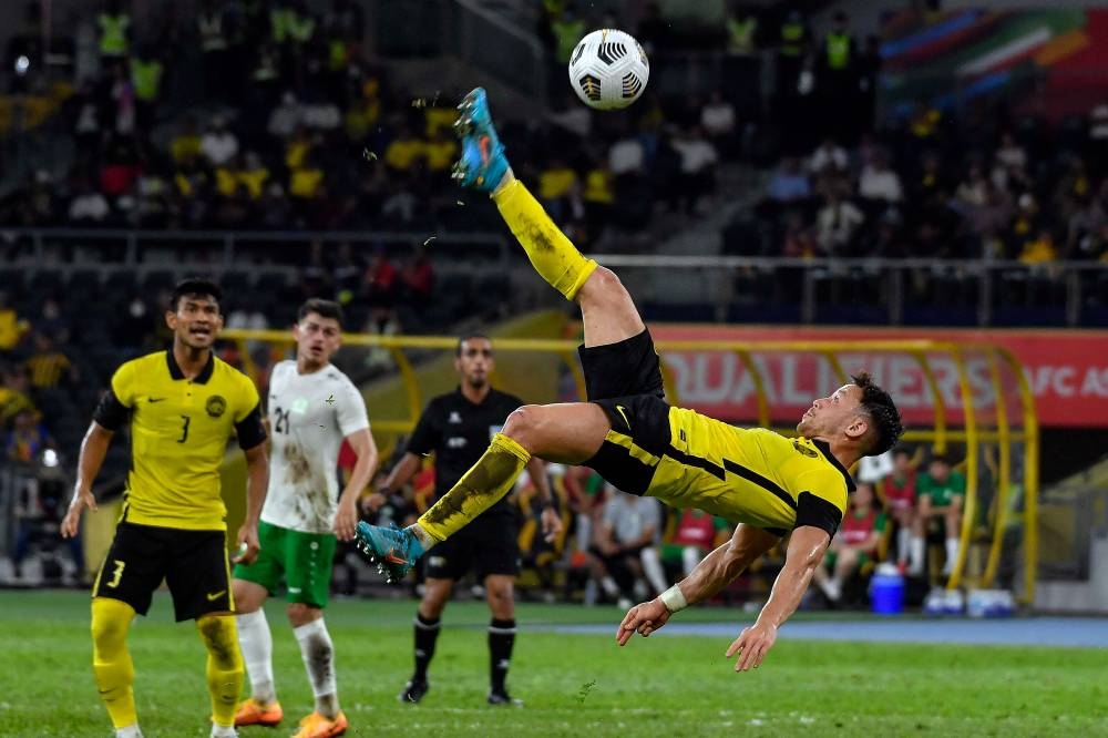 File picture of Harimau Malaya’s Darren Lok in acrobatic action during the match against Turkmenistan at the National Stadium in Bukit Jalil, Kuala Lumpur, June 8, 2022. — Bernama pic
