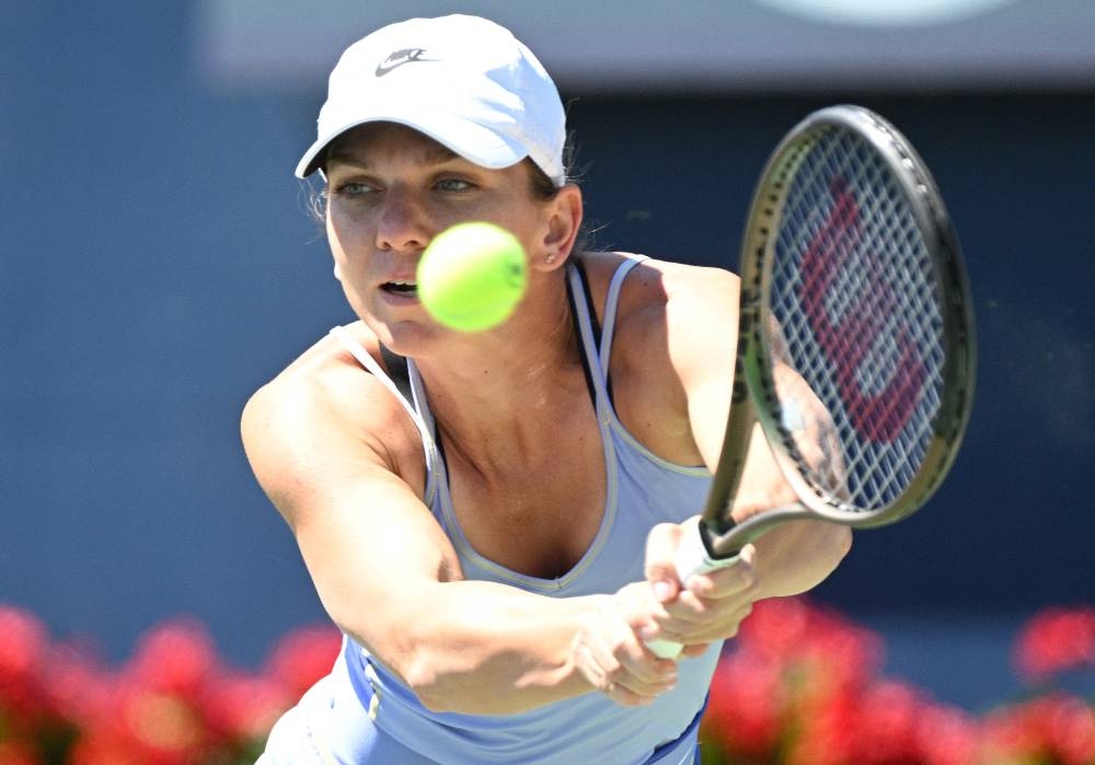 Simona Halep plays a backhand against Beatriz Haddad Maia in the women's final of the National Bank Open at Sobeys Stadium, Toronto August 14, 2022. — Reuters pic