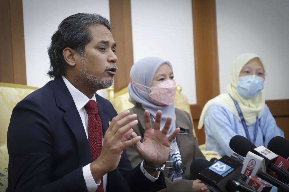 Health Minister Khairy Jamaluddin speaks to the media after attending the Malaysia Book of Records Award presentation ceremony and the launch of the Record-Breaking Covid-19 Vaccination Report: Public Private Partnership in Putrajaya, September 13, 2022. 