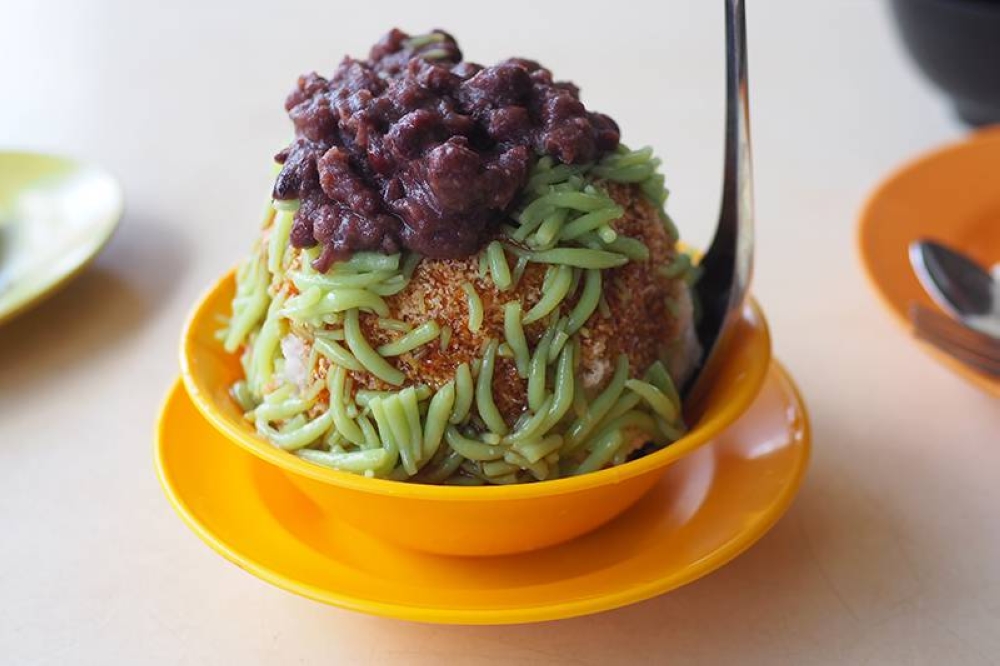For their 'cendol' with red beans, this is draped over the shaved ice mountain.