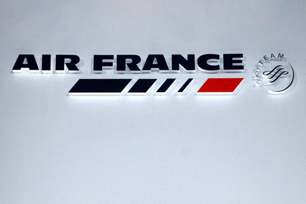 This file photo taken on September 5, 2007 shows the logo of Air France at the Air France headquarters in Roissy. Air France said on september 14, 2022 it would cancel more than half its short- and medium-haul flights on September 16, 2022, as the country's air traffic controllers wage a strike. — AFP pic