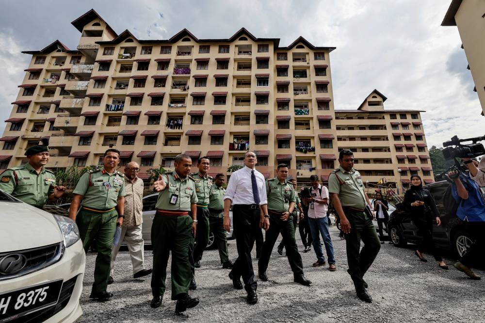 Senior Defence Minister Datuk Seri Hishammuddin Hussein tours the Armed Forces Keluarga Malaysia Houses at Desa Tun Hussein Onn in Kuala Lumpur, September 14, 2022. — Bernama pic 