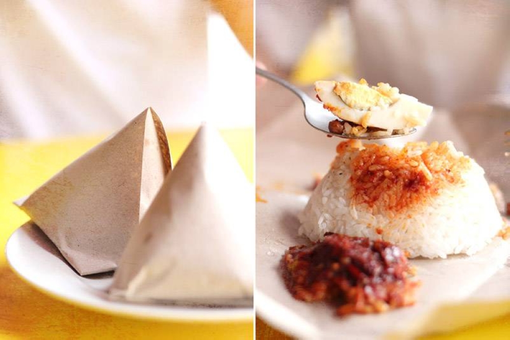 Packets of 'nasi lemak bungkus', with just the basic ingredients of 'sambal' and a sliver of hard boiled egg.