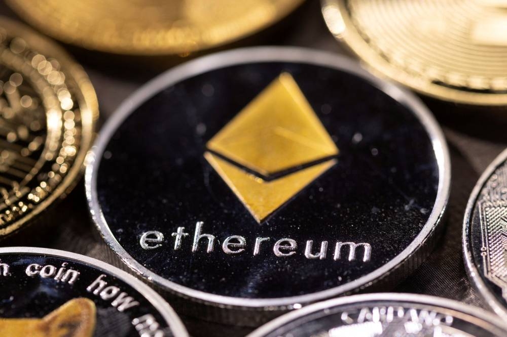 Representation of Ethereum, with its native cryptocurrency ether, is seen in this illustration taken November 29, 2021. — Reuters pic