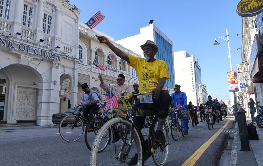 Cyclists take part in Malaysia Day celebrations in George Town, Penang, September 16, 2022. — Bernama pic 