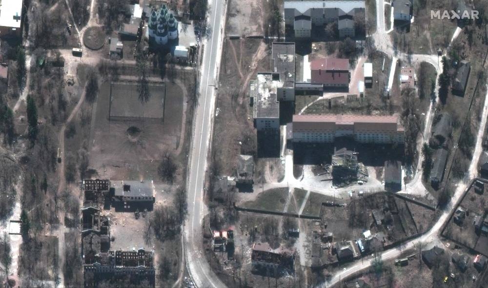 This handout satellite image released by Maxar Technologies on September 16, 2022 shows a damaged hospital and nearby buildings and Izyum, eastern Ukraine on March 24, 2022. — Picture courtesy of  Maxar Technologies  via AFP