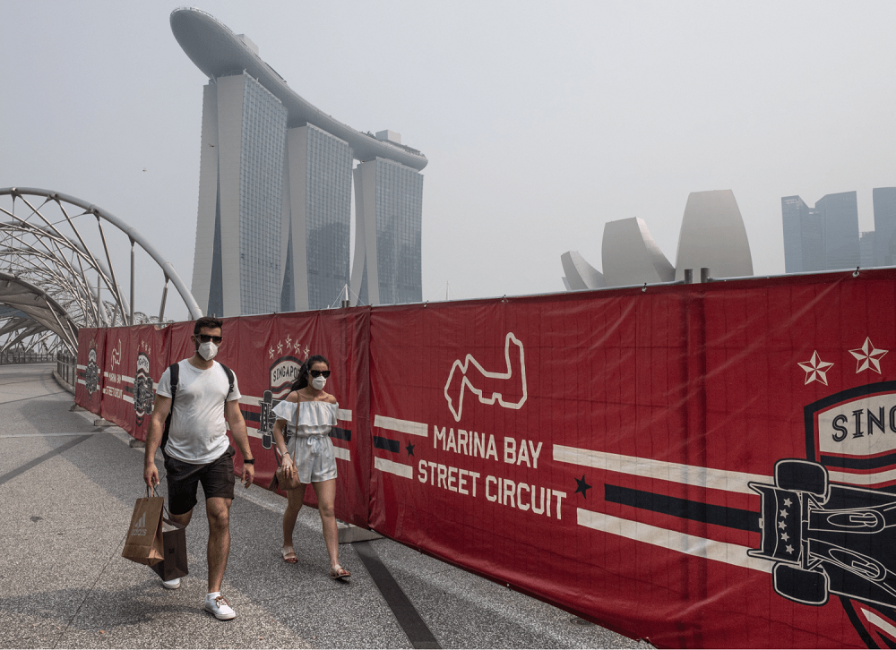 Tourists wearing protective masks as they walked near the Formula One race track while haze blanketed Singapore in September 2019. — TODAY pic