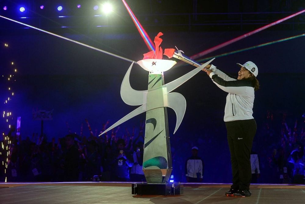 Legendary tenpin bowling queen Shalin Zulkifli lighting the games torch in Bangi September 17, 2022. — Bernama pic 