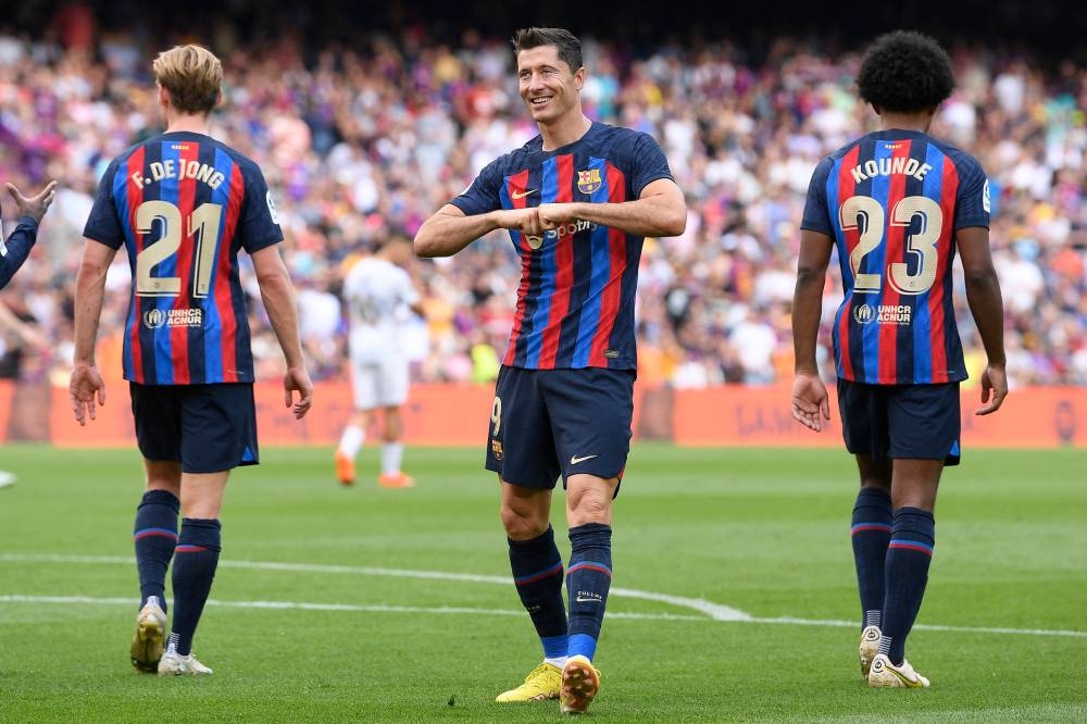 Barcelona's Polish forward Robert Lewandowski celebrates scoring his team's third goal during the Spanish League football match between FC Barcelona and Elche CF at the Camp Nou stadium in Barcelona on September 17, 2022. — AFP pic