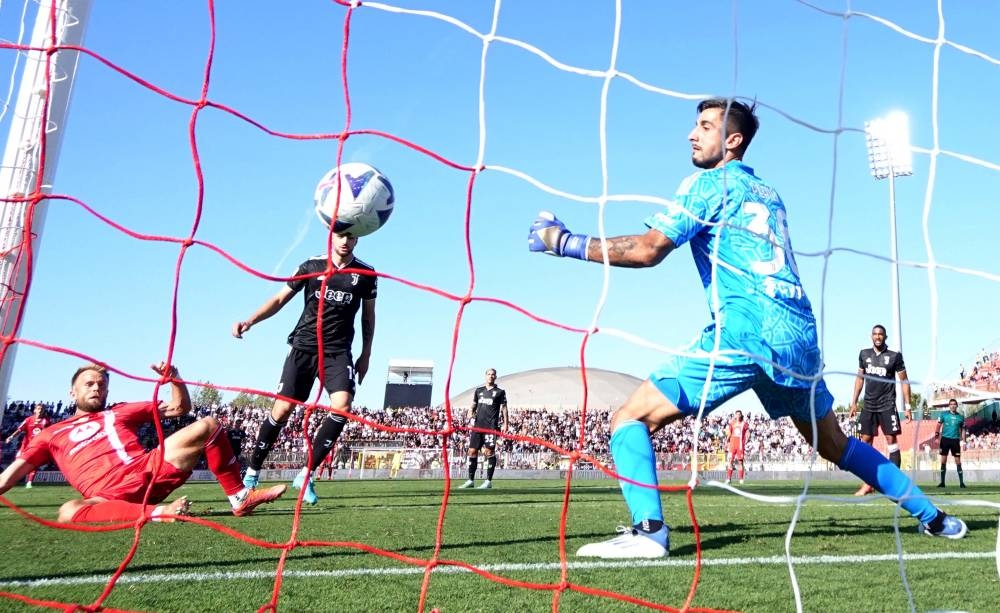 Monza's Christian Gytkjaer scores their first goal past Juventus' Mattia Perin at the Stadio Brianteo, Monza, Italy  September 18, 2022. — Reuters pic 