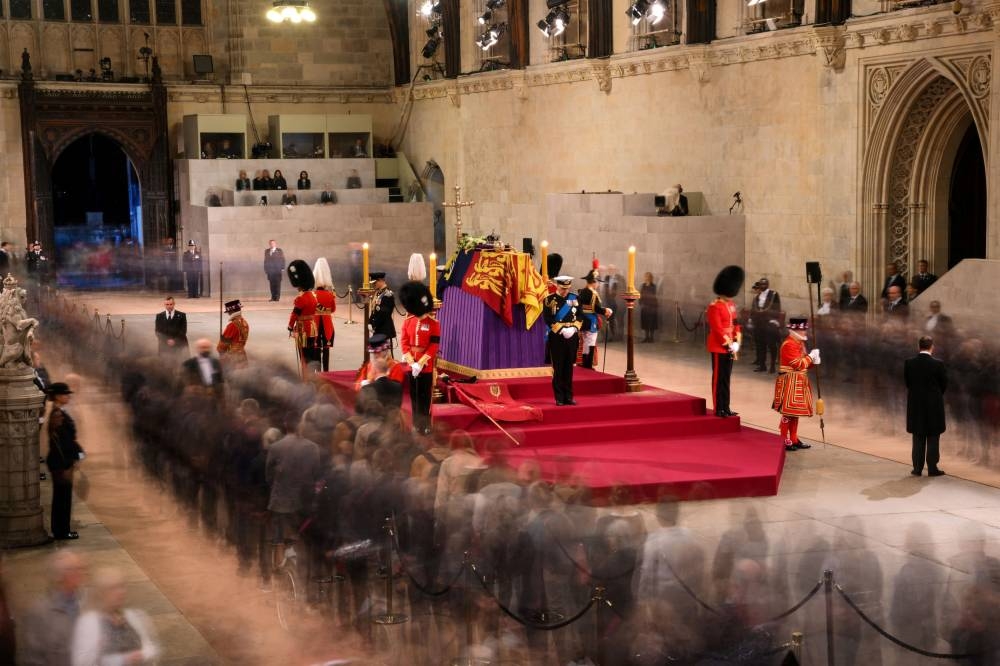 Britain's King Charles III, Britain's Princess Anne, Princess Royal, Britain's Prince Andrew, Duke of York, and Britain's Prince Edward, Earl of Wessex mount a vigil around the coffin of Queen Elizabeth II, draped in the Royal Standard with the Imperial State Crown and the Sovereign's orb and sceptre, lying in state on the catafalque in Westminster Hall, at the Palace of Westminster in London September 16, 2022. — Picture by Daniel Leal/Pool via Reuters