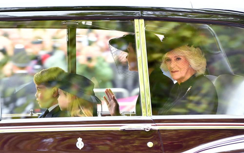 (From left) Prince George of Wales, Princess Charlotte of Wales, Catherine, Princess of Wales and Camilla, Queen consort are seen on The Mall ahead of The State Funeral for Queen Elizabeth II on September 19, 2022 in London. — Anthony Devlin/Pool/Reuters pic