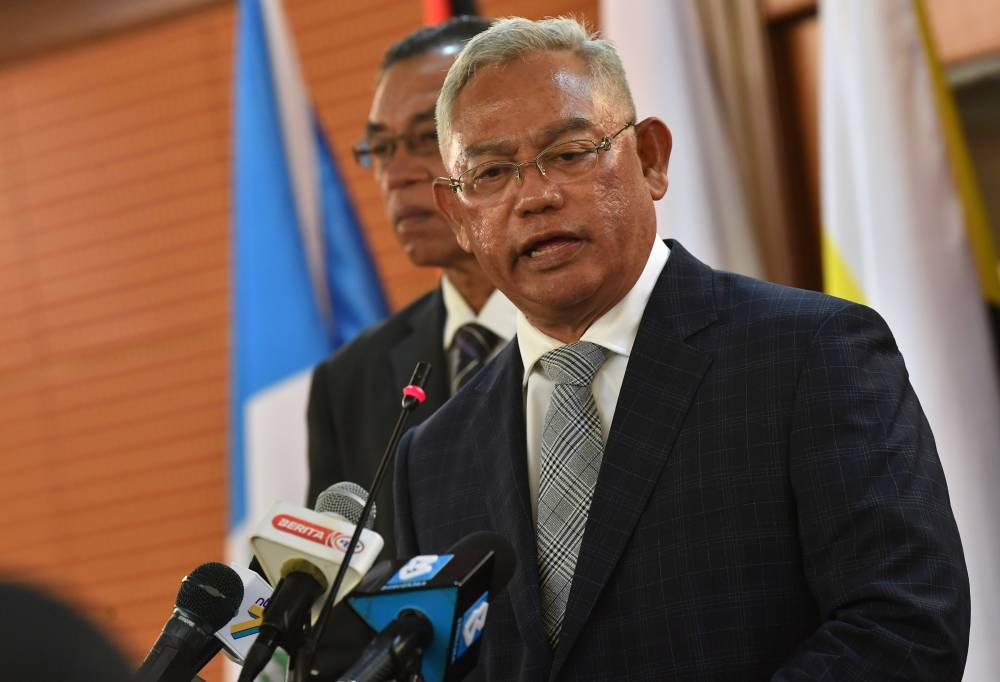 Entrepreneur Development and Cooperatives Minister Tan Sri Noh Omar speaks in a press conference after the 18th Special Task Force on Jihad Against Inflation meeting in Putrajaya September 19, 2022. — Bernama pic