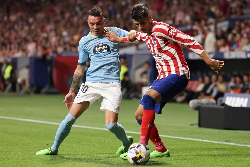 Celta Vigo forward Iago Aspas (left) fights for the ball with Atletico Madrid midfielder Alvaro Morata at the Wanda Metropolitano stadium in Madrid, September 10, 2022. — AFP pic 