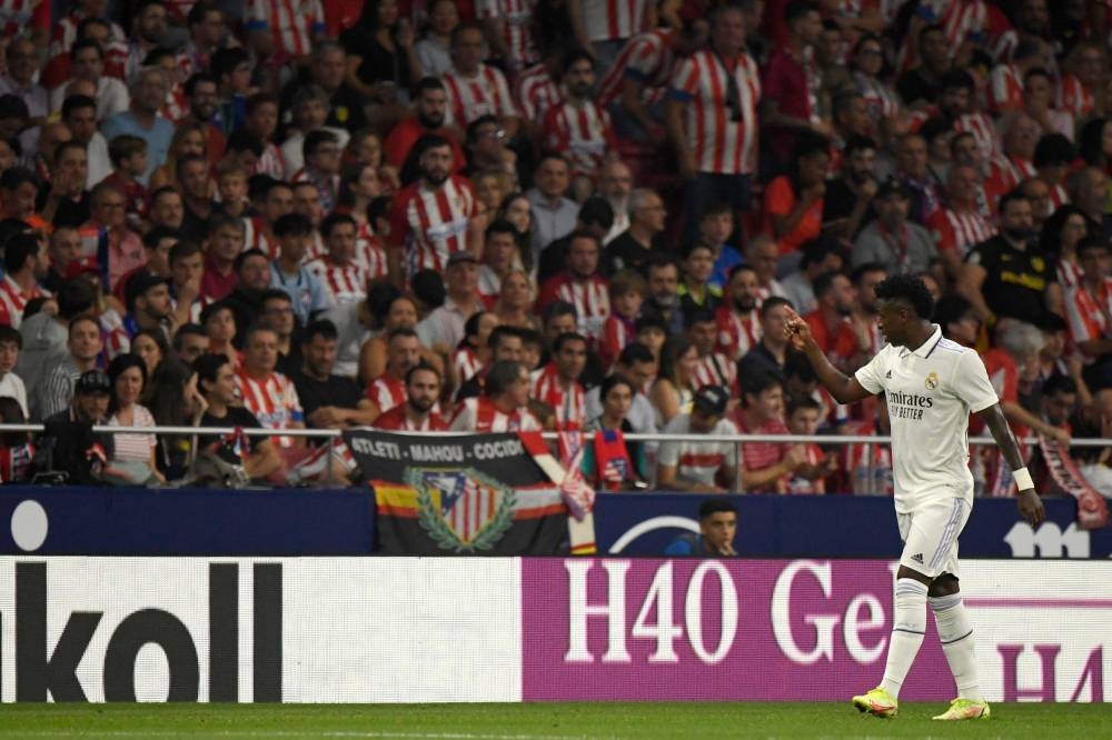 Real Madrid forward Vinicius Junior gestures toward the public during the Spanish League football match between Club Atletico de Madrid and Real Madrid CF at the Wanda Metropolitano stadium in Madrid, September 18, 2022. — AFP pic 