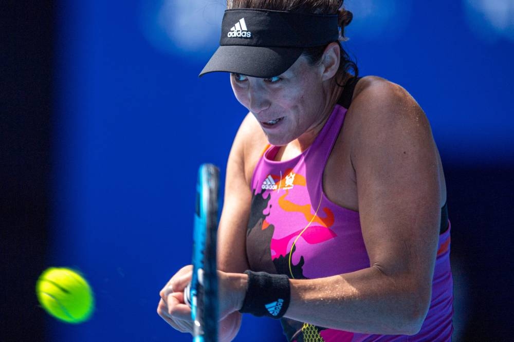 Garbiٌe Muguruza hits a return against Despina Papamichail during their women's singles match on day three of the Pan Pacific Open tennis tournament in Tokyo September 21, 2022. — AFP pic