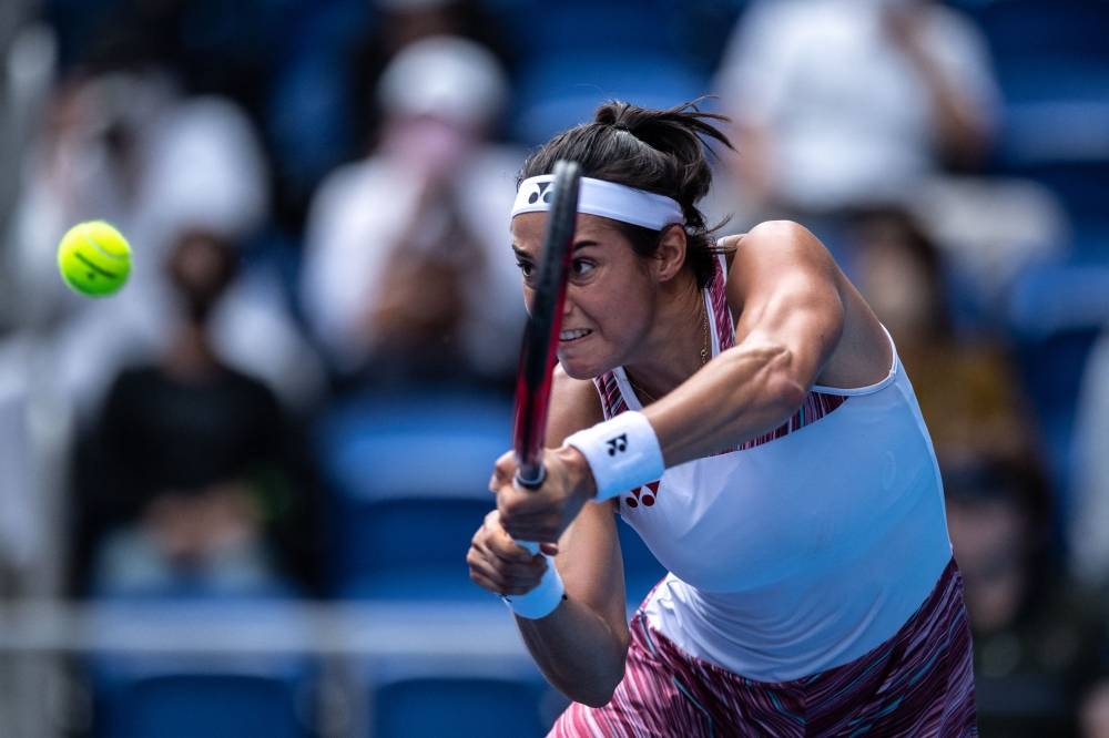 Caroline Garcia of France hits a return against Zhang Shuai of China during their women’s singles match on day three of the Pan Pacific Open tennis tournament in Tokyo, September 21, 2022. — AFP pic 