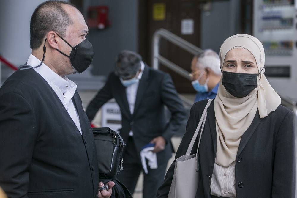 Maj Gen (Rtd) Datuk Fadzlette Othman Merican Idris Merican (right) exits from the Kuala Lumpur Court Complex, September 12, 2022. — Picture by Hari Anggara