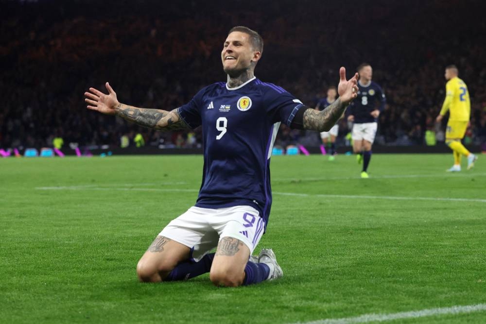 Scotland's Lyndon Dykes celebrates scoring their third goal against Ukraine at Hampden Park, Glasgow September 21, 2022. — Reuters pic