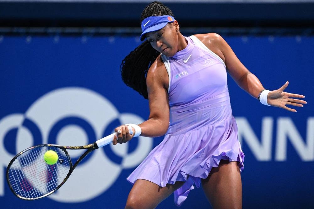 Naomi Osaka hits a return against Daria Saville during their women's singles match on day two of the Pan Pacific Open tennis tournament in Tokyo September 20, 2022. — AFP pic