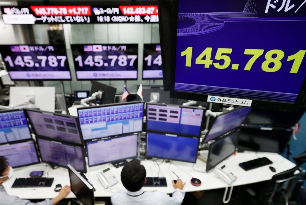 An electronic quotation board displays the yen's rate 145 yen level against the US dollar at a foreign exchange brokerage in Tokyo on September 22, 2022. — Jiji Press/AFP pic