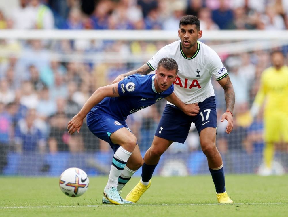Tottenham Hotspur’s Cristian Romero (right) and Manchester United’s Lisandro Martinez were forced to fly back to Argentina to secure a visa to the United States. — Reuters pic