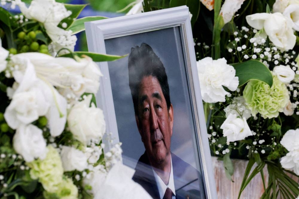 A picture of late former Japanese prime minister Shinzo Abe is seen at Headquarters of the Japanese Liberal Democratic Party in Tokyo, Japan July 12, 2022. ― Reuters file pic