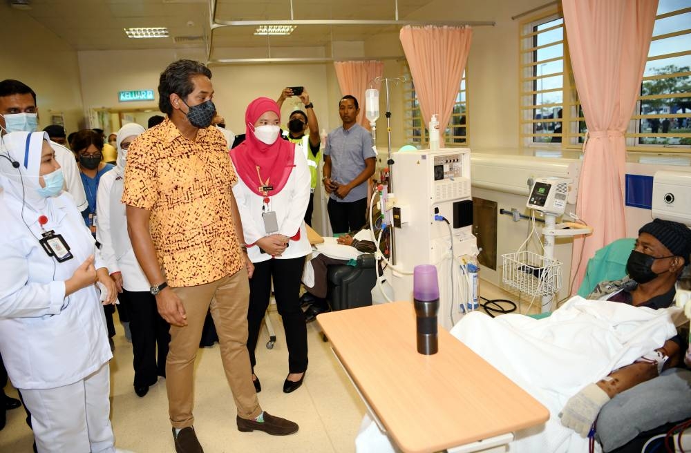 Health Minister Khairy Jamaluddin (second left) visiting patients after inaugurating the Rembau Hospital September 23, 2022. The hospital was completed in 2019 but was inaugurated late due to the Covid-19 pandemic. — Bernama pic