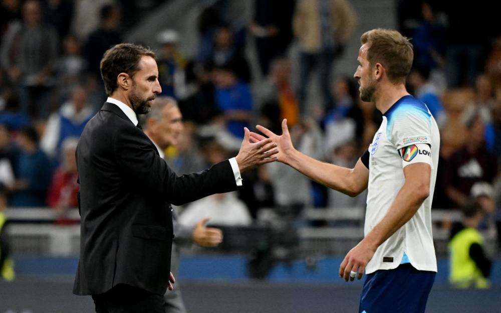 England manager Gareth Southgate shakes hands with Harry Kane after the match against Italy September 24, 2022. ― Reuters pic