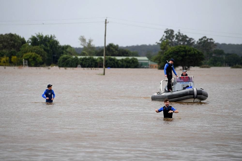 NSW Police Rescue are seen patrolling in floodwater at Windsor, north west of Sydney, Australia, March 3, 2022. ― AAP Image/Dan Himbrechts via Reuters
