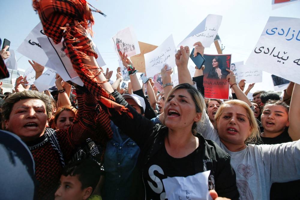 People take part in a protest following the death of Mahsa Amini in front of the United Nations headquarters in Erbil, Iraq September 24, 2022. ― Reuters pic