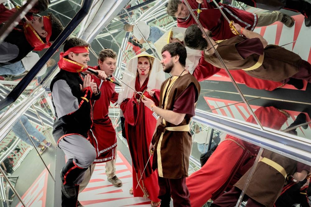 A group of cosplayer visit Comic Con Africa, the largest pop colture, fantasy and gaming festival of the continent, are reflected in the mirror room at the Nasrec Expo Centre in Johannesburg, on September 23, 2022. ― AFP pic