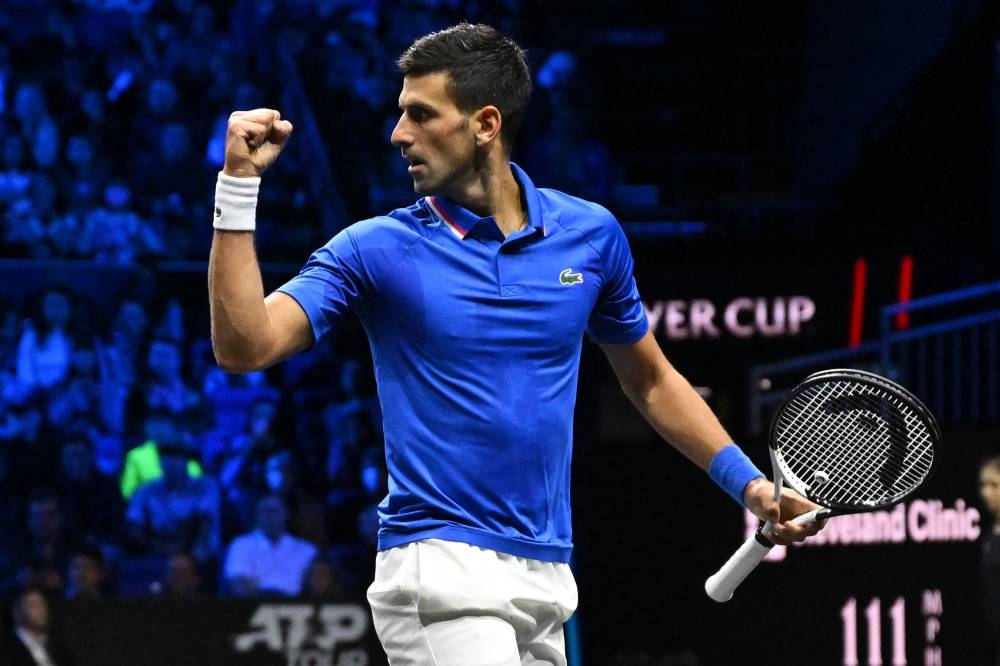 Novak Djokovic of Team Europe reacts while playing against Frances Tiafoe of Team World during their 2022 Laver Cup men's singles tennis match at the O2 Arena in London on September 24, 2022. — AFP pic