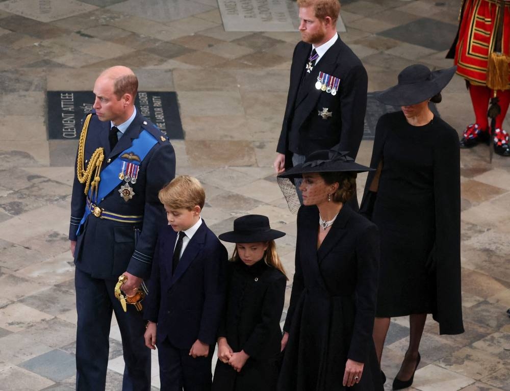Britain’s William, Prince of Wales, Prince George of Wales, Princess Charlotte of Wales, Catherine, Princess of Wales, Prince Harry, Duke of Sussex and Meghan, Duchess of Sussex attend the state funeral and burial of Queen Elizabeth, at Westminster Abbey in London, Britain, September 19, 2022. — AFP pic
