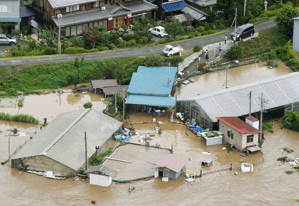 An aerial view showing inundated buildings and structures caused by swollen river, seen in Nagahama, western Japan, hit by heavy rain caused by Typhoon Noru, in this photo taken by Kyodo August 8, 2017. — Kyodo/via Reuters