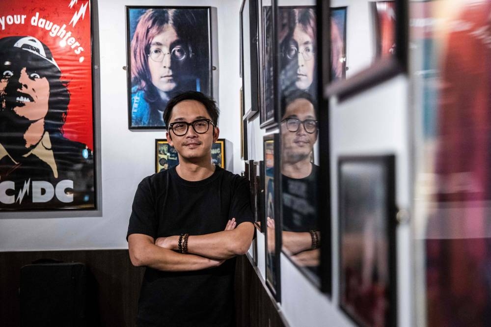 This picture taken on September 9, 2022 shows director of Hong Kong Musicians Foundation Adrian Fu posing for a photograph at The Wanch, a live music venue in Hong Kong. — AFP pic