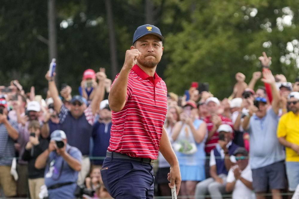 Xander Schauffele celebrates clinching the win for Team USA on the 18th green during the singles match play of the Presidents Cup golf tournament at Quail Hollow Club in Charlotte September 25, 2022.   — Reuters pic