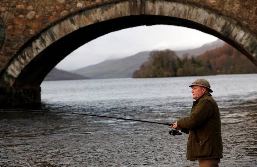 An angler casts his line on the opening day of the salmon fishing season on the River Tay at Kenmore in Scotland January 15, 2018. — Reuters file pic